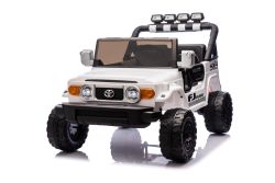 Coche eléctrico para niños Toyota FJ Cruiser XXL con tracción 4x4, licencia oficial (dos plazas), bianca, batería de litio portátil, chasis alto, dos asientos, suspensión trasera, control remoto 2.4 GHz, reproductor MP3 con Bluetooth, luces LED