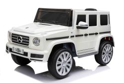 Coche eléctrico para niños Mercedes G500 12V, blanca , control remoto 2.4 GHz, entrada USB / SD, suspensión trasera, batería de litio, luces LED, licencia ORIGINAL